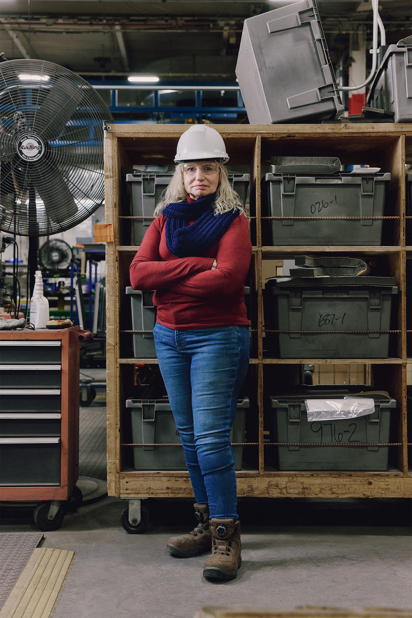 Woman standing in front of shelves in a Rehlko factory