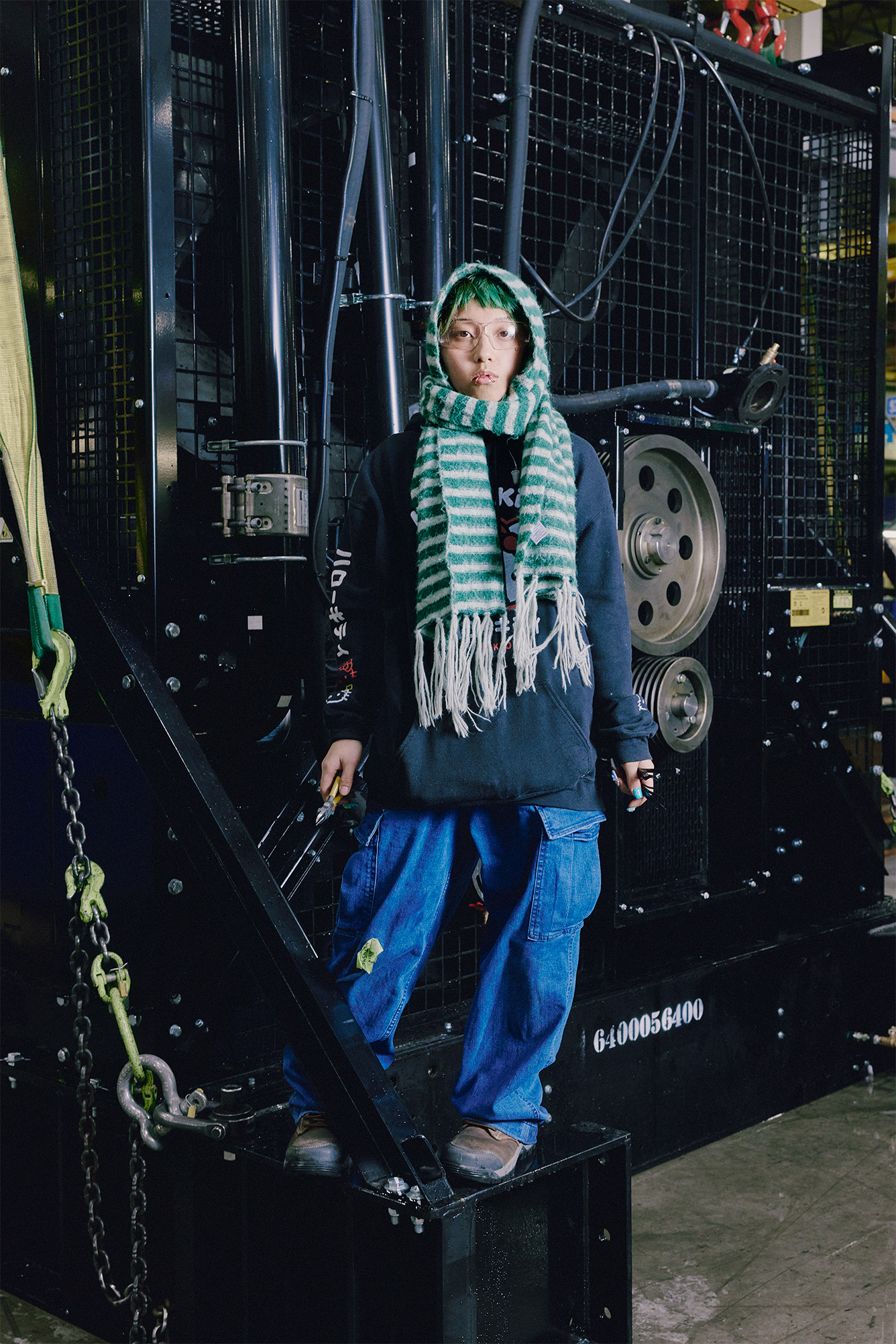 Woman standing in front of an industrial Rehlko generator