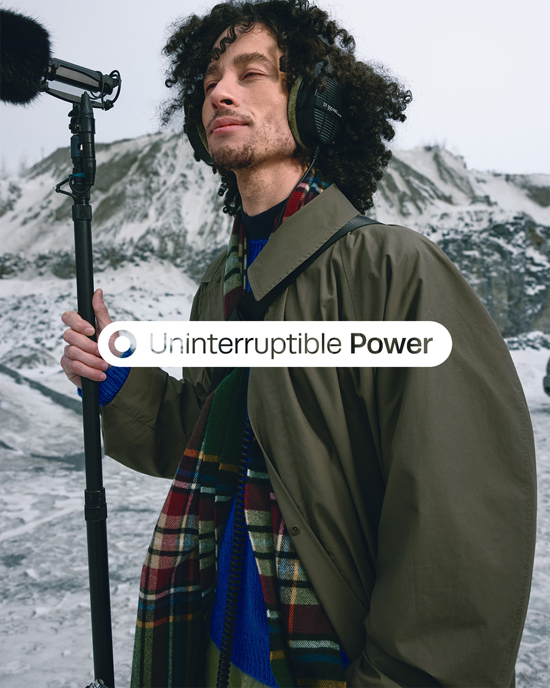 Man capturing sound outside